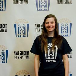 student picture in front of Yale Student Film Festival poster