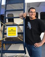 Adam Wassilchalk standing on the right. On the left, a a sign that reads "No Admittance: Crew Use Only"